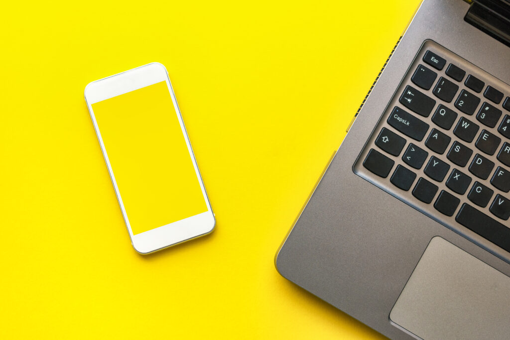 Smartphone mock up screen and laptop computer